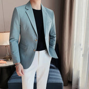 Men's stylish single-breasted suit jacket in light blue, ideal for business and party settings.