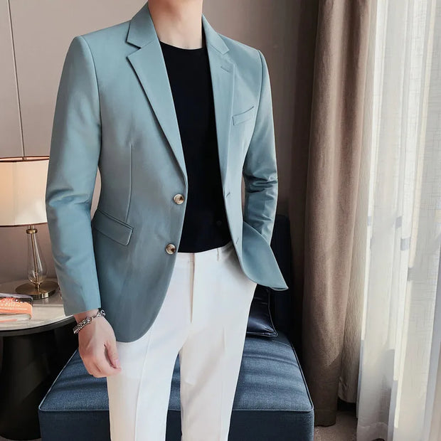 Men's stylish single-breasted suit jacket in light blue, ideal for business and party settings.